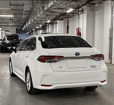 byd e1: Toyota Corolla: 2020 г., 1.8 л, Вариатор, Гибрид, Седан — 5