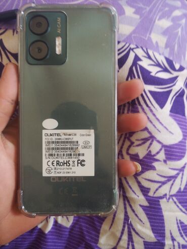 Oukitel C36 modeli, yaşıl rəngdə olan bu smartfon gündəlik istifadə