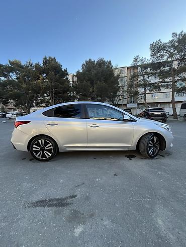 accent: Hyundai Accent sedan – gümüş rəng Əsas xüsusiyyətlər: - Kuzov: 4 — 3