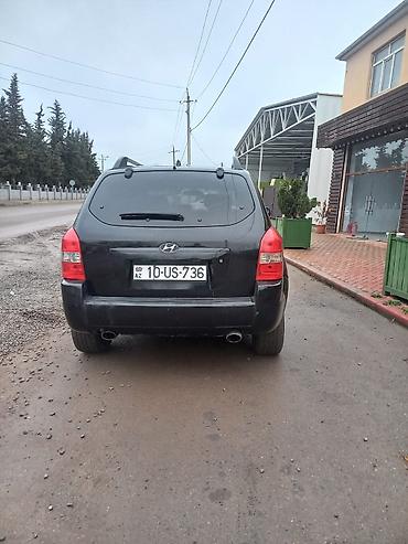 l200 disk: Hyundai Tucson, qara rəng, şəhər və uzun yol üçün rahat SUV. Texniki — 4