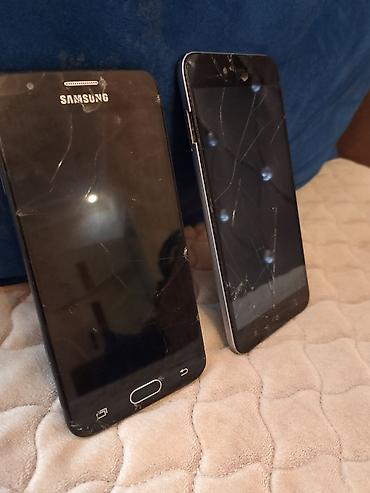 philips xenium x703: İki ədəd smartfon dəsti 1) Samsung smartfon - Arxa qapaqda “SAMSUNG” — 2