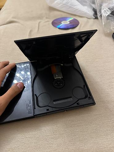 ps2 diskləri: PlayStation 2 Slim oyun konsolu. Kompakt və nazik korpusa malik PS2 — 5