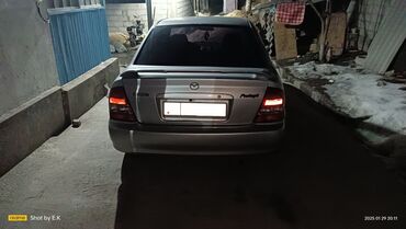 амортизатор на рекс: Mazda Protege: 2002 г., 2 л, Автомат, Бензин, Седан