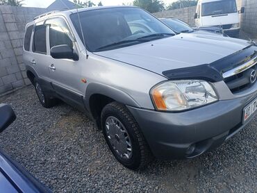авто мусо: Продается Mazda Tribute серебристого цвета. Этот компактный