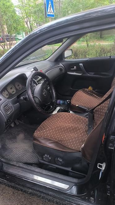 agm: Mazda 323: 2003 г., 2 л, Механика, Газ, Универсал — 1