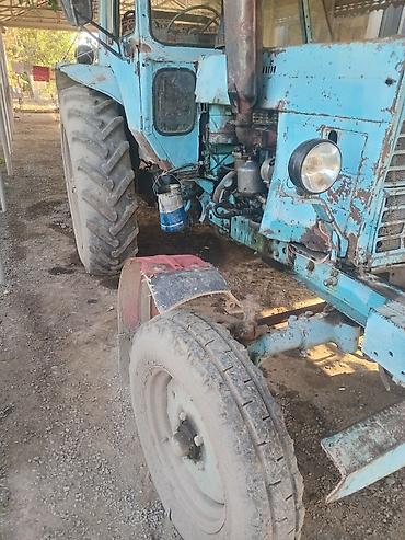 traktor 82: Kənd təsərrüfatı işləri üçün traktor. Şəkillərdə kabinalı, iri arxa — 1