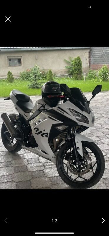 мазда кронус бампер: Спортивный мотоцикл Kawasaki Ninja в белом цвете с черными элементами