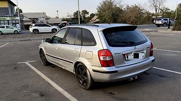 bmb e36: Mazda 323: 1999 г., 1.6 л, Механика, Бензин, Универсал — 7