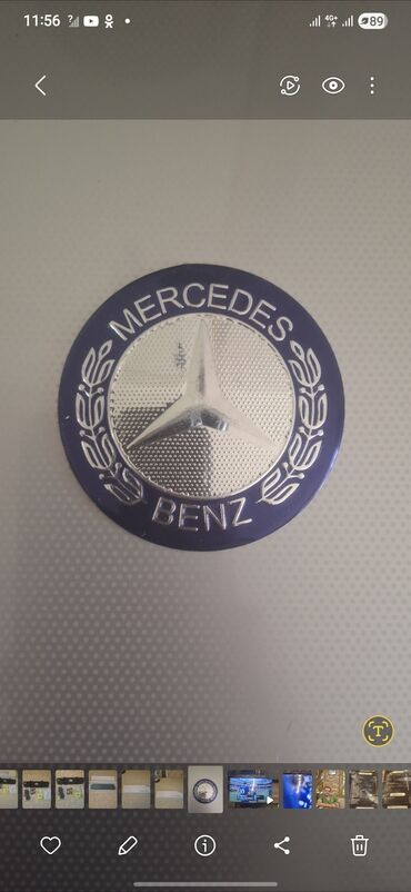 təkər mersedes: Dairəvi Mercedes-Benz emblemi, tünd göy haşiyəli və mərkəzində gümüşü