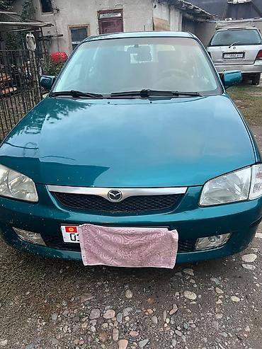Mazda Familia: 1999 г., 1.5 л, Автомат, Бензин, Седан at lalafo.kg Mazda Familia: 1999 г., 1.5 л, Автомат, Бензин, Седан