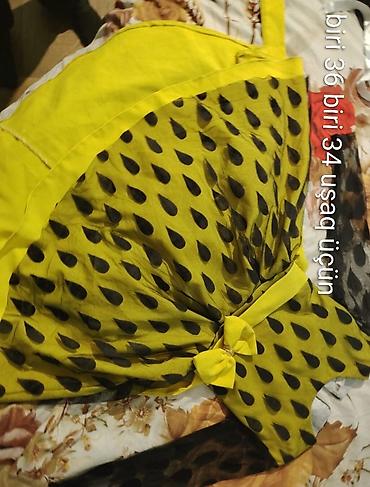 Платья: Uşaq paltarı – sarı-yaşıl tonlarda, qara damcı naxışlı - Ölçülər: biri — 1