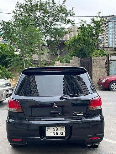 mitsubishi az: Mitsubishi Airtrek (Black) – şəhər və uzun yol üçün çox yönlü kompakt — 3
