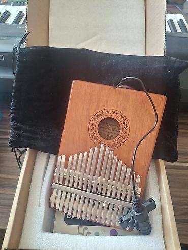ozcan deniz konsert: Kalimba seti – 17 dillə, rezonans deşikli taxta korpus Xüsusiyyətlər — 1