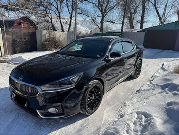 кия карневал: Черный седан Kia K7, 2017года черными многоспицевыми дисками и