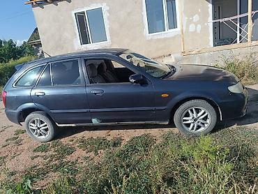 прокладка впускного коллектора: Mazda 323: 2001 г., 1.6 л, Механика, Бензин, Универсал — 1