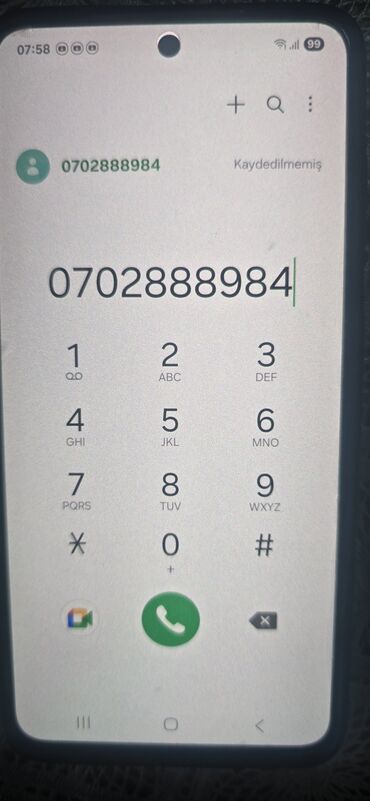 philips xenium 9@9z: Ekranında telefon nömrəsi yığılmış smartfon. "0702888984" nömrəsi