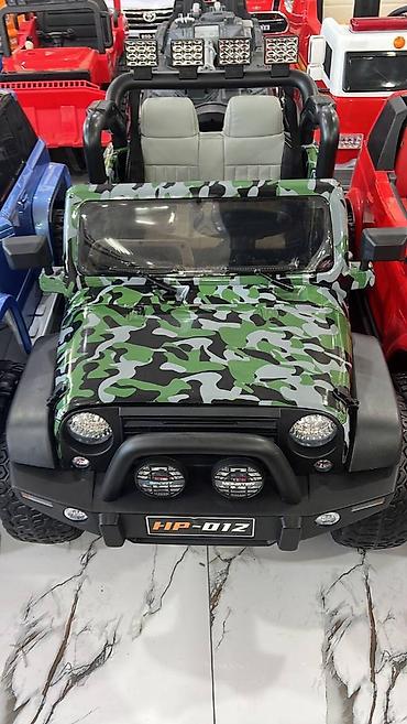 Uşaq üçün elektrik maşınları: Hərbi və ağ rəng rəngləri ilə stocklarıza yenidən gələn Jeep Hp-012 — 2