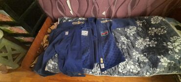 русский язык 3 класс мсо 4: Göy rəngdə ESTIMO brendinə məxsus döyüş sənəti kimonosu. Bu kimono