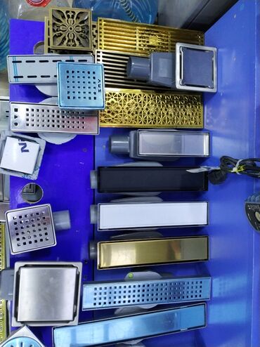 Унитазы: Müxtəlif növ və dizaynda drenaj süzgəcləri, həmçinin duş kanalları