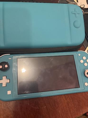 nintendo switch 3 lite: Nintendo switch lite üzerinde cantası. hic bir problemi yoxdu — 3