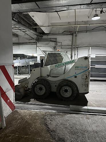 Услуги мини-погрузчика (Bobcat) - Компактный колесный мини-погрузчик