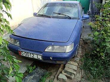 купить двигатель д 245: Автомобиль Daewoo Espero синего цвета, выполненный в кузове седан. На