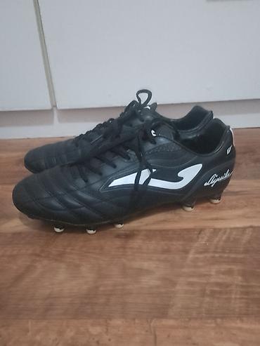 Kopačke: Kopačke Joma Aguila – crno‑bele - Model: Joma Aguila (logo i natpis — 7