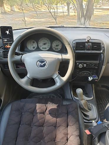 аудио касета: Mazda Capella: 2002 г., 2 л, Механика, Универсал — 7
