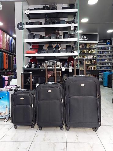 Çamadanlar: Məhsul: 3-lü səfər çamadan dəsti - Rəng: qara - Material: toxumalı — 1