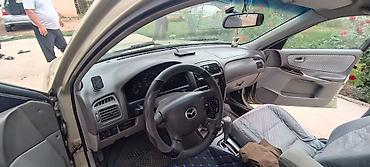 требуется тонар: Mazda Capella: 2000 г., 2 л, Автомат, Бензин, Седан — 4