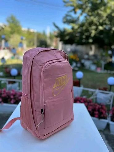 doca torbe: Rančevi sa štampom Nike motiva - Modeli: roze ranac sa žutim Nike — 3
