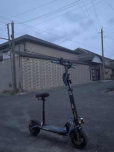 elektrik velo: Elektrik skuter – off-road təkərlər və güclü işıqlanma ilə saata 60 km — 1