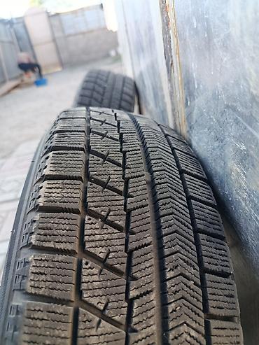 жели: Пара зимних колес в сборе на штампованных дисках. - Шины: Bridgestone — 2