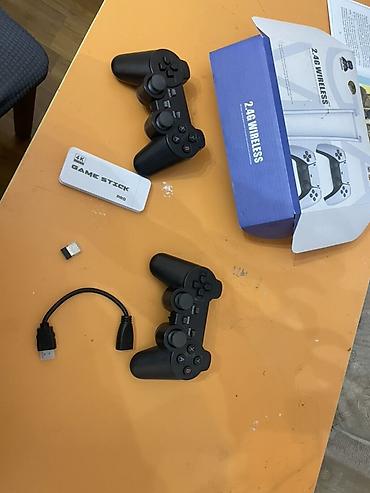 Игровой комплект Game Stick Pro 4K + 2 беспроводных геймпада (2.4G)