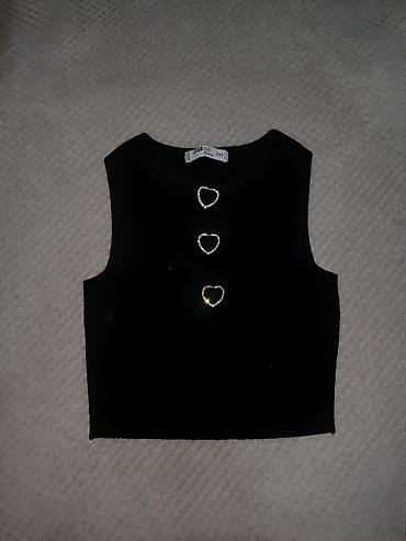 pull bear rs: Crni ženski top bez rukava, jednostavnog i elegantnog kroja. Model ima — 1