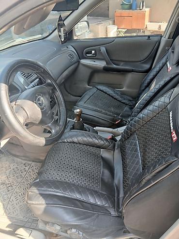 пф 021: Mazda 323: 2003 г., Механика, Бензин, Универсал — 5