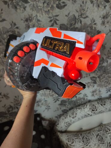 Игрушки: Продаю детский пулемет NERF 
на батарейках .
состояние нового