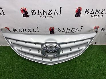 mazda 2000: Решетка радиатора Mazda 2004 г., Б/у, Оригинал — 4