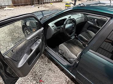 мини электро: Mazda 323: 2000 г., 1.3 л, Механика, Бензин, Седан — 8