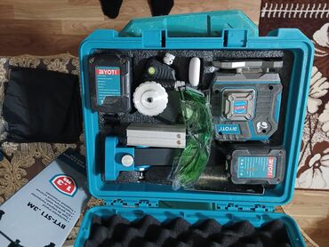 isvec divarı: Şəkillərdə BIYOTI markalı bir lazer səviyyə (lazer nivelir) cihazı və