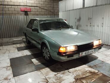 химия авто: Mazda 626: 1984 г., 1.6 л, Механика, Бензин, Седан
