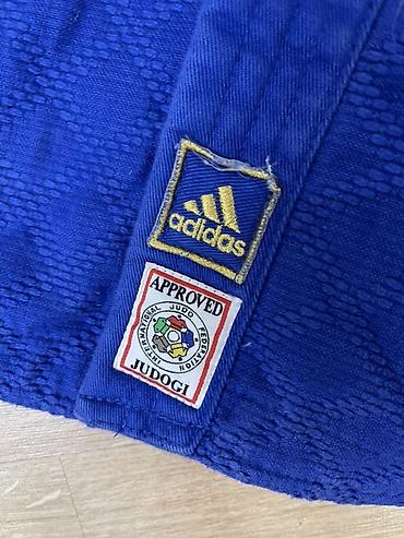 пояса дзюдо: Синее кимоно для дзюдо Adidas Champion + штаны Вверх лицензионный - — 6