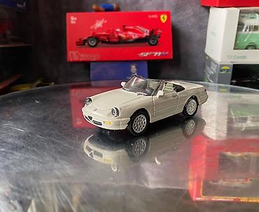 Avtomobil modelləri: Коллекционная модель Alfa Romeo Spider crème 1989 NewRay Scale 1:43 — 2