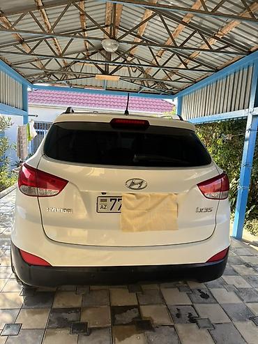 premier hazard siren: Hyundai ix35 – ağ rəngli, şəhər və uzun məsafələr üçün rahat — 8