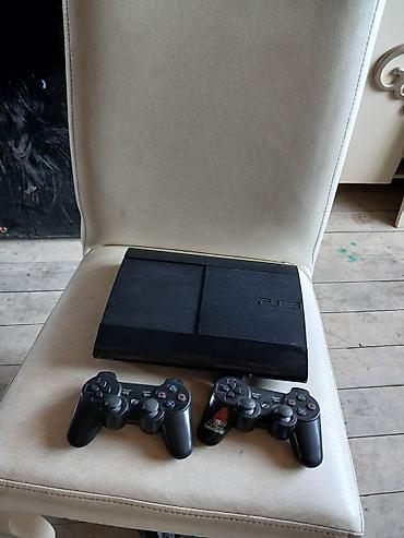playstation icarəsi: Sony PlayStation 3 (PS3) oyun konsolu. Şəkillərdə qara rəngli PS3 — 1