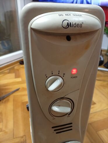 Uljani radijatori: Ulje­ni radijator Midea sa 12 rebara i ispravnim ventilatorom - Tip — 3