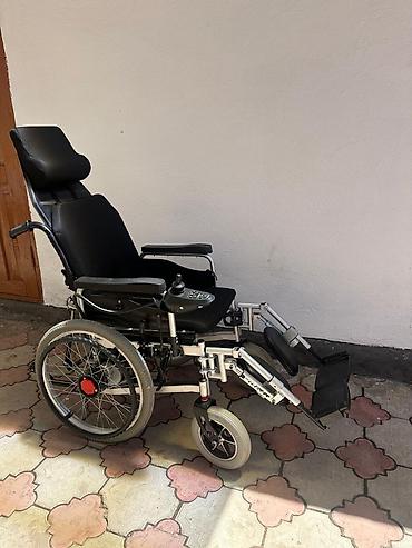 Электрическая инвалидная коляска с регулируемым риклайном -