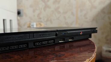 сколько стоит playstation 2: PlayStation 2 model SCPH-90004 işlək vəziyyətdədir, sadəcə saat