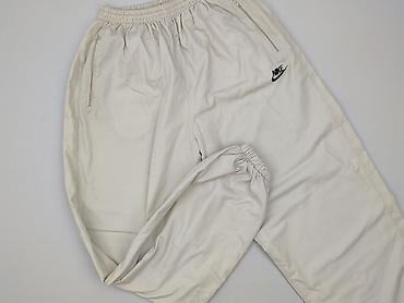 nike tech damski: Nike, Spodnie dresowe damskie, rozmiar L — 1