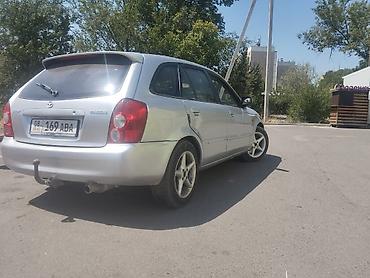 Унаа: Mazda 323: 2003 г., Кол менен иштөөчү, Бензин, Универсал — 1